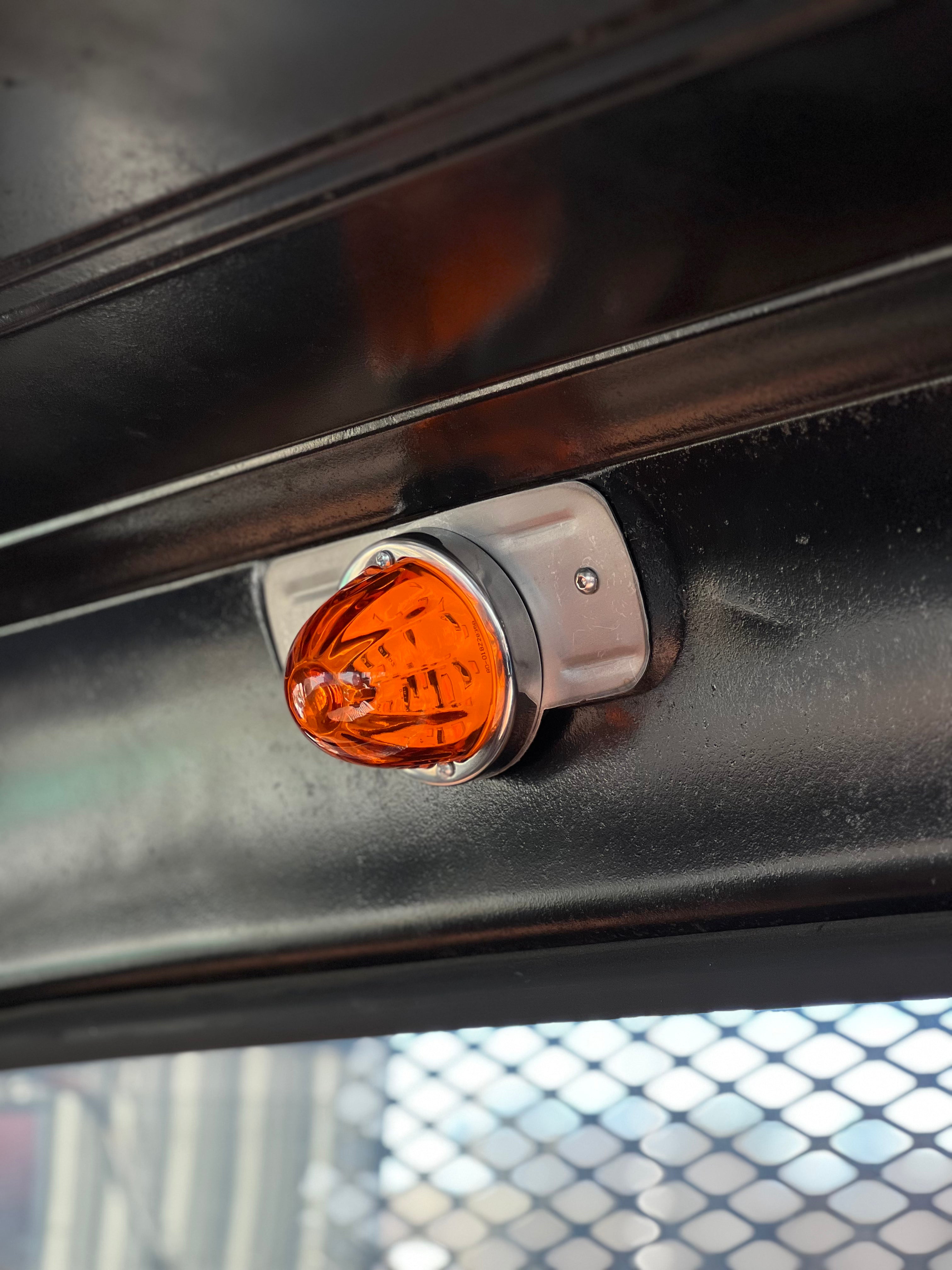 Watermelon glass dome light installed in a classic Chevy truck cab