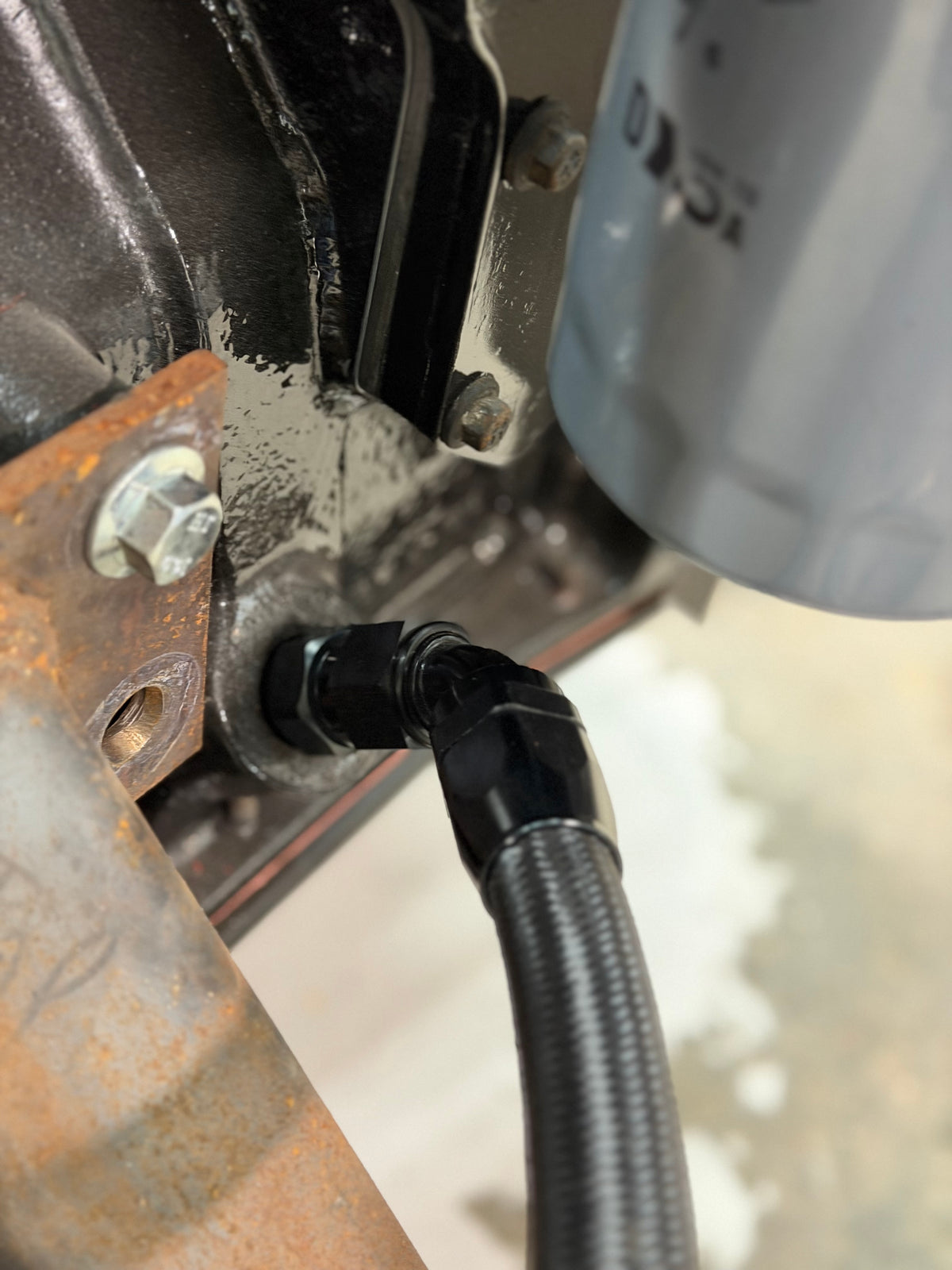 -10AN oil drain line with 45-degree fitting at the block