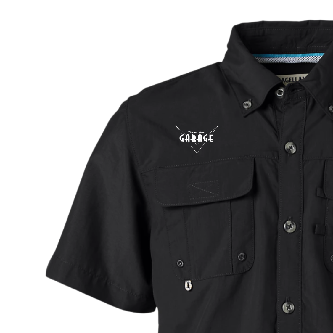 Close-up of the embroidered Brown Bros. Garage logo on the black Magellan fishing shirt