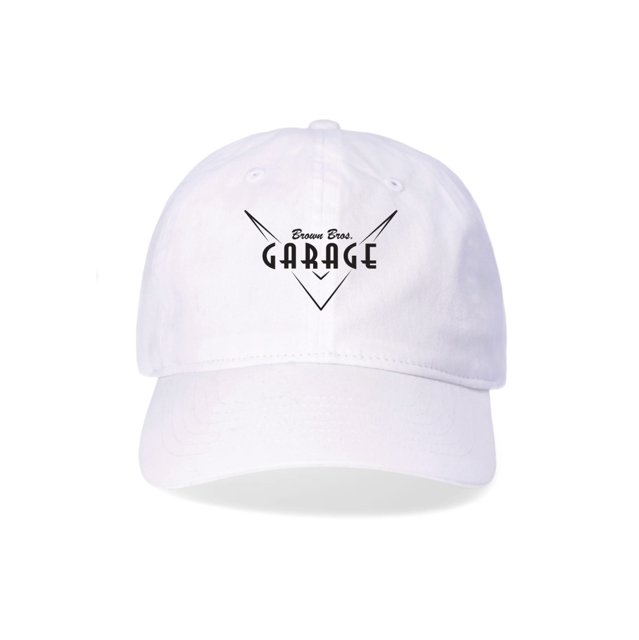 White dad hat with the embroidered Brown Bros. Garage logo