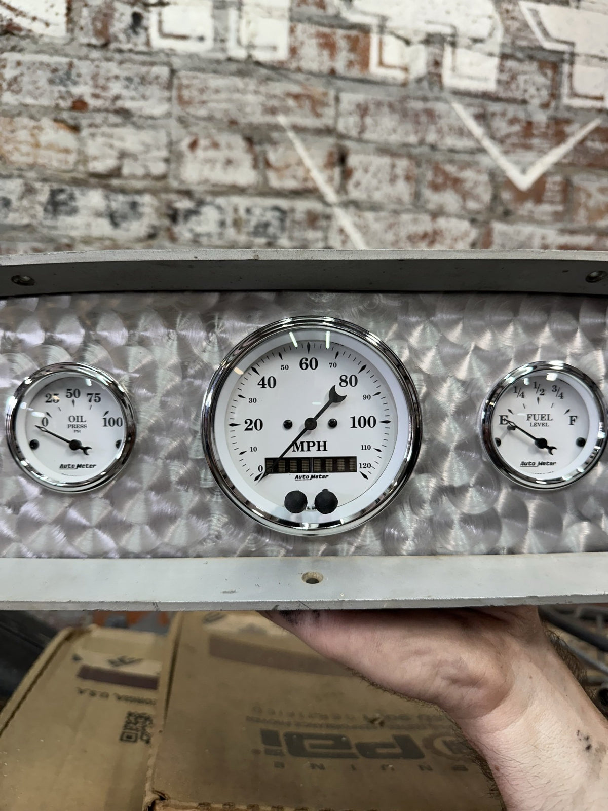 Close-up of the AutoMeter speedometer, fuel and oil pressure gauges