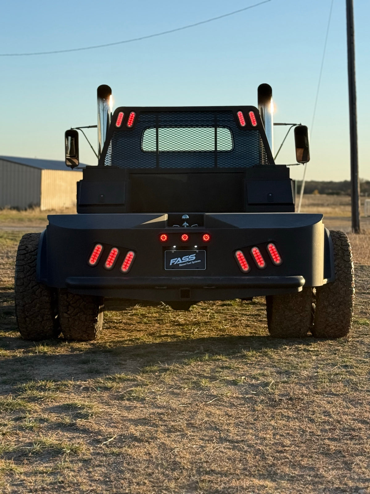 Rear of Eeyore with the flatbed, taillights and twin stacks