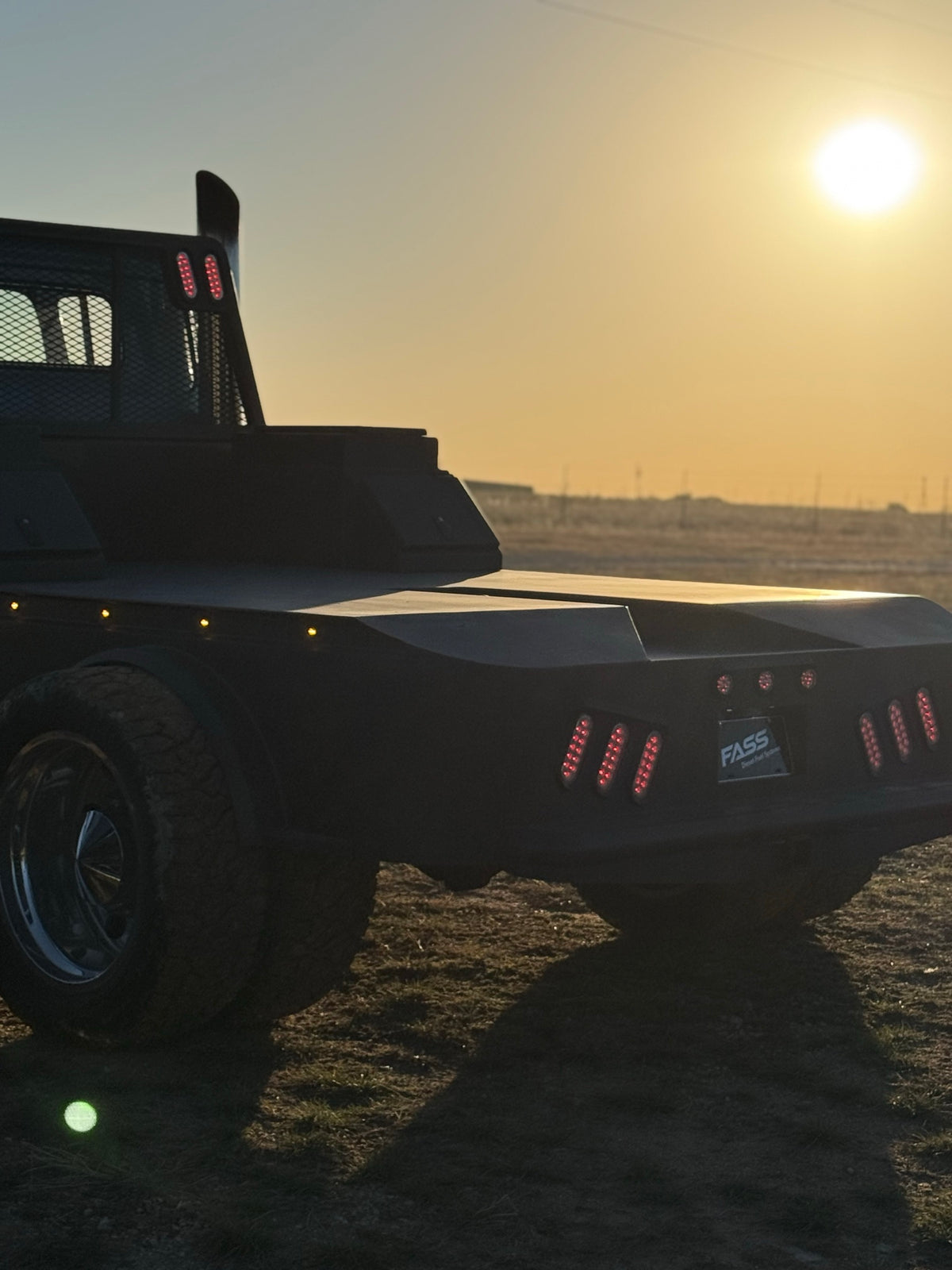 Eeyore's flatbed and taillights at sunset