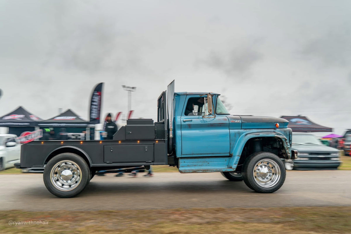 Eeyore, a 1962 Chevy Viking with a 5.9 common rail swap, parked at an event