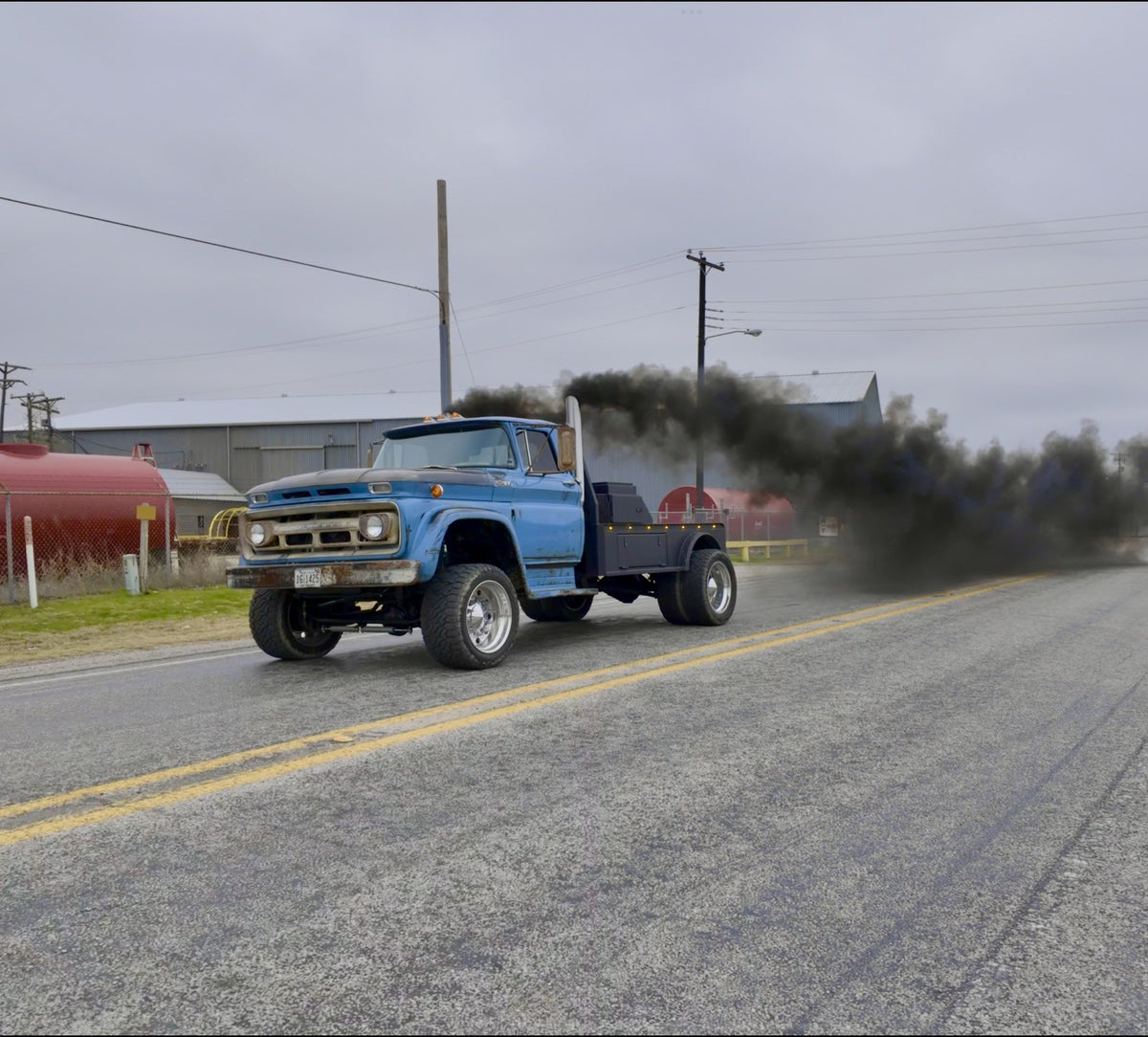 Eeyore, a blue 1962 Chevy Viking with a 5.9 common rail, rolling down the road throwing smoke