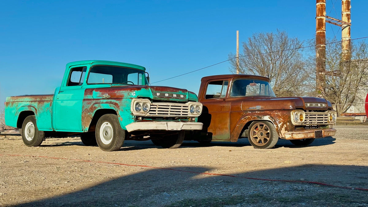 1959 Ford F100 next to a second classic Ford truck