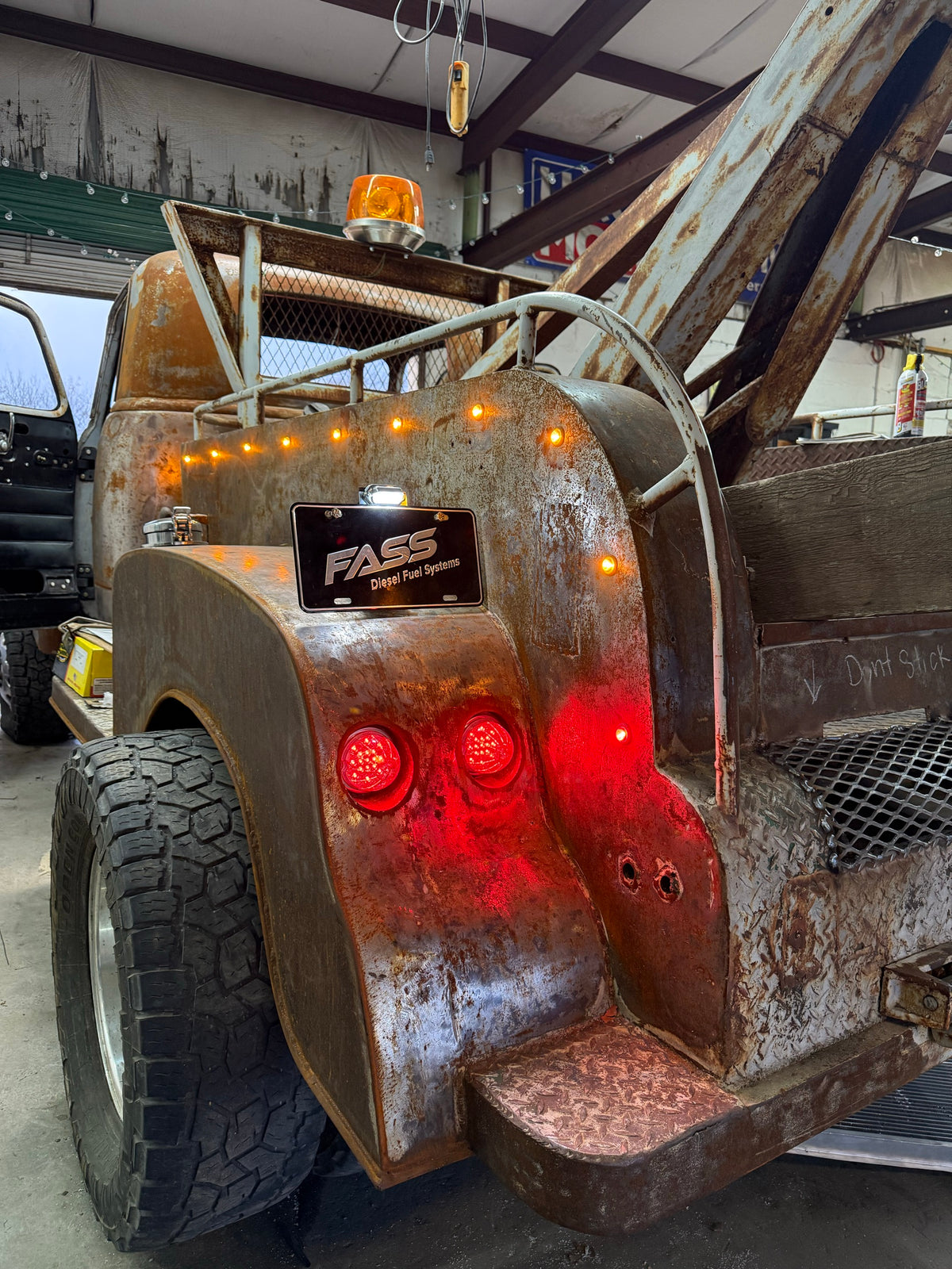 Rear of Roadrunner, the 1950 Chevy tow truck, with its tow boom, lights and FASS plate