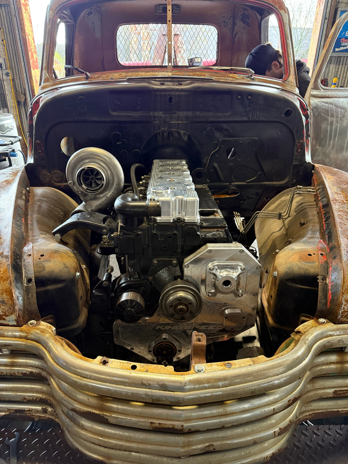 Diesel engine set into Roadrunner's engine bay during the swap